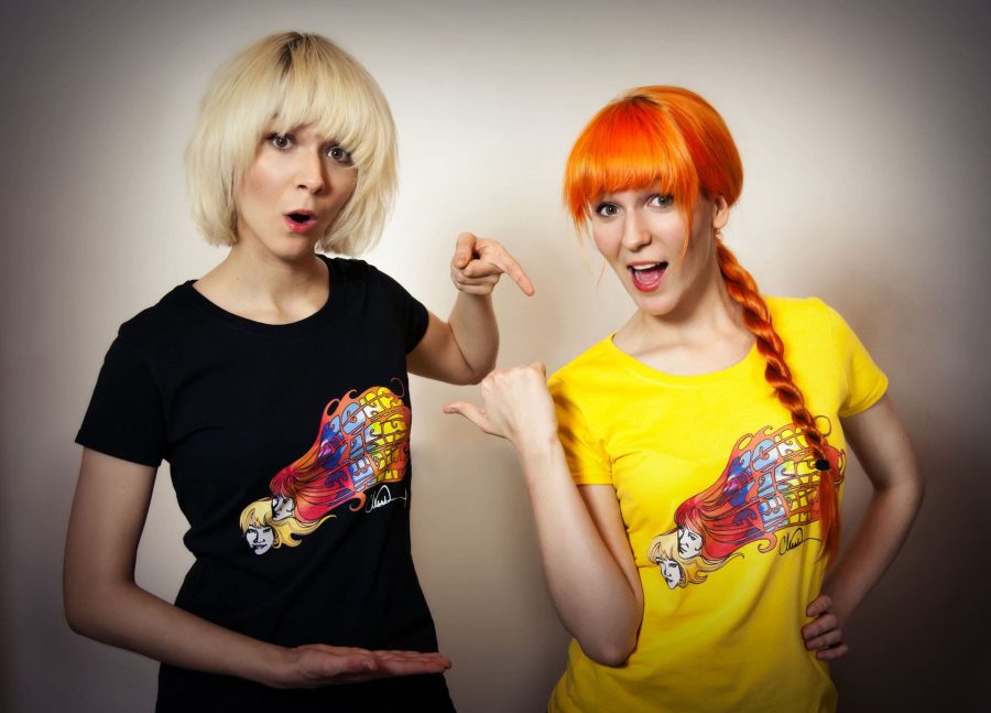 MonaLisa Twins modeling their band T-shirts designed by "Walking Dead" illustrator Charlie Adlard